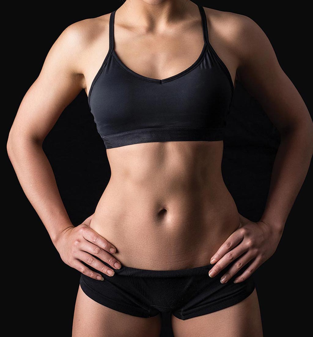 Woman showing her sculpted midsection and arms.